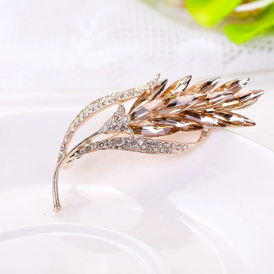 Sitaria Crystal Straight Grain Brooch - An elegant crystal brooch crafted from an assortment of marquise cut crystals arranged to look like heads of grain, in either a golden champagne colour or a rainbow gradient.