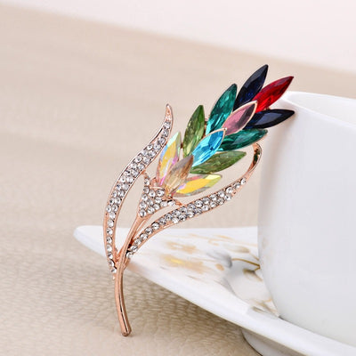 Sitaria Crystal Straight Grain Brooch - An elegant crystal brooch crafted from an assortment of marquise cut crystals arranged to look like heads of grain, in either a golden champagne colour or a rainbow gradient.