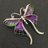 Skylar Long-Tail Butterfly Brooch - A lovely medium-sized butterfly brooch featuring colourful enamel and shiny artificial crystals. Available in your choice of blues or purple and green.