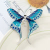 Skylar Long-Tail Butterfly Brooch - A lovely medium-sized butterfly brooch featuring colourful enamel and shiny artificial crystals. Available in your choice of blues or purple and green.