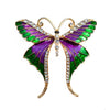 Skylar Long-Tail Butterfly Brooch - A lovely medium-sized butterfly brooch featuring colourful enamel and shiny artificial crystals. Available in your choice of blues or purple and green.