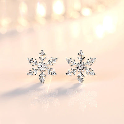 The Snow Queen II Jewellery Set - Crystal Tipped - A delicate snowflake-themed set of necklace and earrings, featuring snowflakes formed from textured silver with crystals set into the centre and tips.