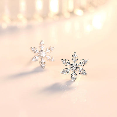The Snow Queen II Jewellery Set - Crystal Tipped - A delicate snowflake-themed set of necklace and earrings, featuring snowflakes formed from textured silver with crystals set into the centre and tips.