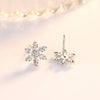 The Snow Queen II Jewellery Set - Crystal Tipped - A delicate snowflake-themed set of necklace and earrings, featuring snowflakes formed from textured silver with crystals set into the centre and tips.