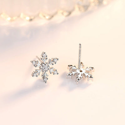 The Snow Queen II Jewellery Set - Crystal Tipped - A delicate snowflake-themed set of necklace and earrings, featuring snowflakes formed from textured silver with crystals set into the centre and tips.