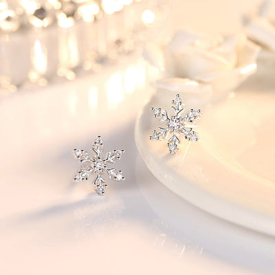The Snow Queen II Jewellery Set - Crystal Tipped - A delicate snowflake-themed set of necklace and earrings, featuring snowflakes formed from textured silver with crystals set into the centre and tips.