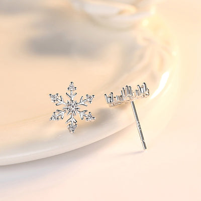 The Snow Queen II Jewellery Set - Crystal Tipped - A delicate snowflake-themed set of necklace and earrings, featuring snowflakes formed from textured silver with crystals set into the centre and tips.