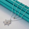 The Snow Queen II Jewellery Set - Crystal Tipped - A delicate snowflake-themed set of necklace and earrings, featuring snowflakes formed from textured silver with crystals set into the centre and tips.