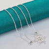 The Snow Queen II Jewellery Set - Crystal Tipped - A delicate snowflake-themed set of necklace and earrings, featuring snowflakes formed from textured silver with crystals set into the centre and tips.