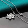The Snow Queen II Jewellery Set - Crystal Tipped - A delicate snowflake-themed set of necklace and earrings, featuring snowflakes formed from textured silver with crystals set into the centre and tips.
