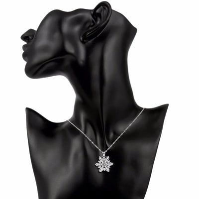 The Snow Queen II Jewellery Set - Crystal Tipped - A delicate snowflake-themed set of necklace and earrings, featuring snowflakes formed from textured silver with crystals set into the centre and tips.