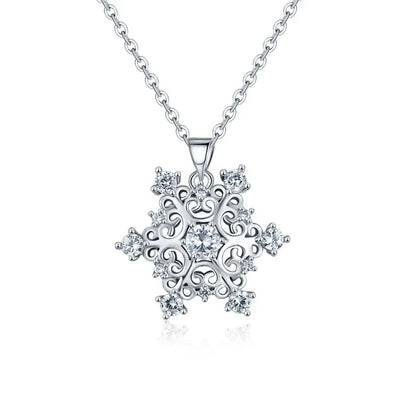The Snow Queen II Jewellery Set - Crystal Tipped - A delicate snowflake-themed set of necklace and earrings, featuring snowflakes formed from textured silver with crystals set into the centre and tips.