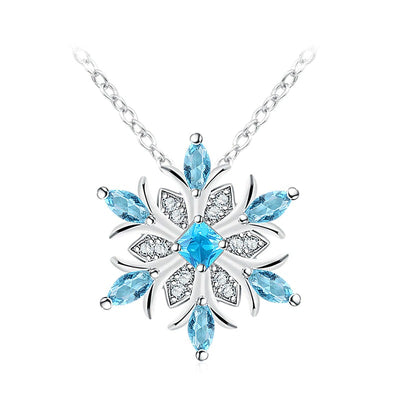 The Snow Queen II Jewellery Set - A beautiful snowflake pendant and earrings with blue topaz and white quartz stones.