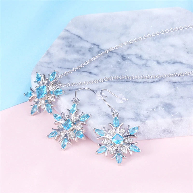 The Snow Queen III Jewellery Set  - Blue Topaz - A beautiful snowflake pendant and earrings with blue topaz and white quartz stones. 