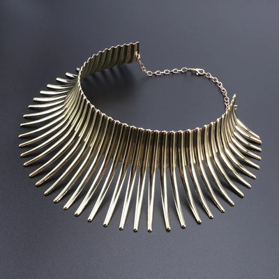 Solaris Radiant Statement Collar - A large metal choker/collar featuring long metal rays radiating out from the wearer's neck.