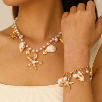 Sora Summer Imitation Seashell Jewellery Set - A large, colourful jewellery set covered in artificial pearls, shells, and cute golden starfish charms.