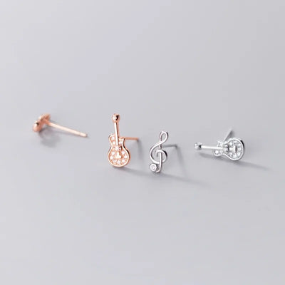 Stefani Music Note & Instrument Crystal Stud Earrings - A pair of teeny tiny asymmetrical stud earrings, one a music note and one a little stylised guitar, made from beautiful 925 Sterling Silver and 14 karat rose gold.