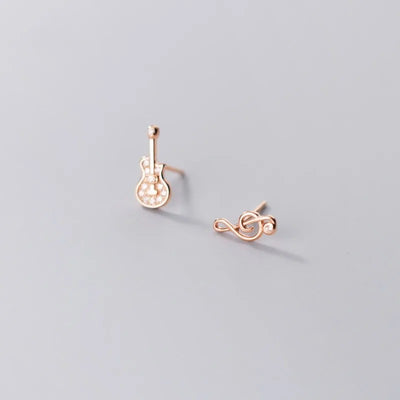 Stefani Music Note & Instrument Crystal Stud Earrings - A pair of teeny tiny asymmetrical stud earrings, one a music note and one a little stylised guitar, made from beautiful 925 Sterling Silver and 14 karat rose gold.