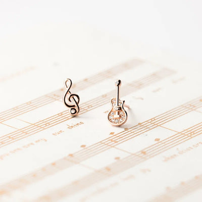 Stefani Music Note & Instrument Crystal Stud Earrings - A pair of teeny tiny asymmetrical stud earrings, one a music note and one a little stylised guitar, made from beautiful 925 Sterling Silver and 14 karat rose gold.
