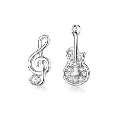 Stefani Music Note & Instrument Crystal Stud Earrings - A pair of teeny tiny asymmetrical stud earrings, one a music note and one a little stylised guitar, made from beautiful 925 Sterling Silver and 14 karat rose gold.