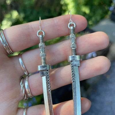 Takeko Gothic Katana Earrings - A pair of large, stylised dark silver toned stylised katana earrings.