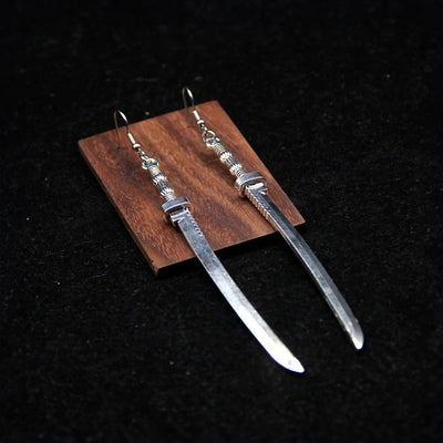 Takeko Gothic Katana Earrings - A pair of large, stylised dark silver toned stylised katana earrings.