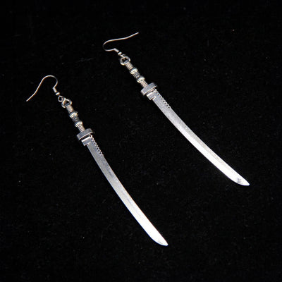 Takeko Gothic Katana Earrings - A pair of large, stylised dark silver toned stylised katana earrings.