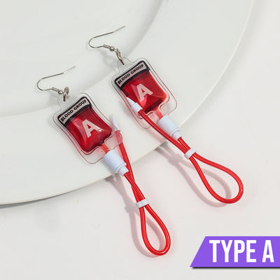 Teenytopia Naughty Nurse Blood Bag Earrings - Cute, stylish Halloween earrings featuring a tiny bag of blood and cables suspended from a French hook.