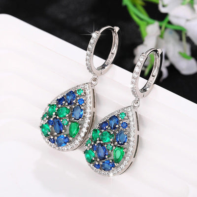 Terra Earth & Sky Crystal Drop Pendant & Earrings Set - An elegant teardrop-shaped pendant and earrings featuring a mixture of green and dark blue crystals, trimmed with delicate white crystals.