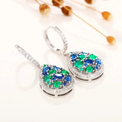 Terra Earth & Sky Crystal Drop Pendant & Earrings Set - An elegant teardrop-shaped pendant and earrings featuring a mixture of green and dark blue crystals, trimmed with delicate white crystals.
