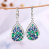 Terra Earth & Sky Crystal Drop Pendant & Earrings Set - An elegant teardrop-shaped pendant and earrings featuring a mixture of green and dark blue crystals, trimmed with delicate white crystals.