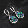 Terra Earth & Sky Crystal Drop Pendant & Earrings Set - An elegant teardrop-shaped pendant and earrings featuring a mixture of green and dark blue crystals, trimmed with delicate white crystals.