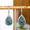 Terra Earth & Sky Crystal Drop Pendant & Earrings Set - An elegant teardrop-shaped pendant and earrings featuring a mixture of green and dark blue crystals, trimmed with delicate white crystals.