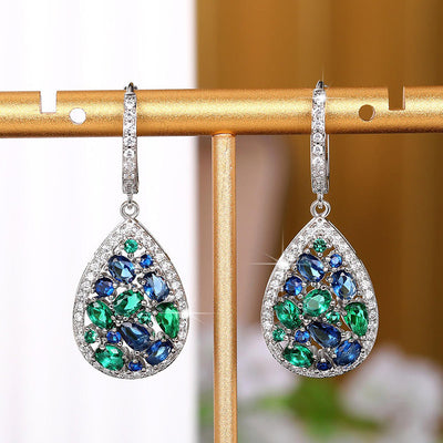 Terra Earth & Sky Crystal Drop Pendant & Earrings Set - An elegant teardrop-shaped pendant and earrings featuring a mixture of green and dark blue crystals, trimmed with delicate white crystals.