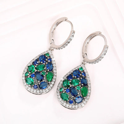 Terra Earth & Sky Crystal Drop Pendant & Earrings Set - An elegant teardrop-shaped pendant and earrings featuring a mixture of green and dark blue crystals, trimmed with delicate white crystals.