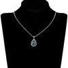Terra Earth & Sky Crystal Drop Pendant & Earrings Set - An elegant teardrop-shaped pendant and earrings featuring a mixture of green and dark blue crystals, trimmed with delicate white crystals.