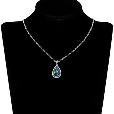 Terra Earth & Sky Crystal Drop Pendant & Earrings Set - An elegant teardrop-shaped pendant and earrings featuring a mixture of green and dark blue crystals, trimmed with delicate white crystals.