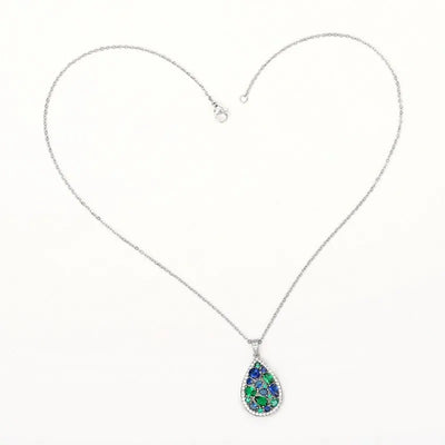 Terra Earth & Sky Crystal Drop Pendant & Earrings Set - An elegant teardrop-shaped pendant and earrings featuring a mixture of green and dark blue crystals, trimmed with delicate white crystals.