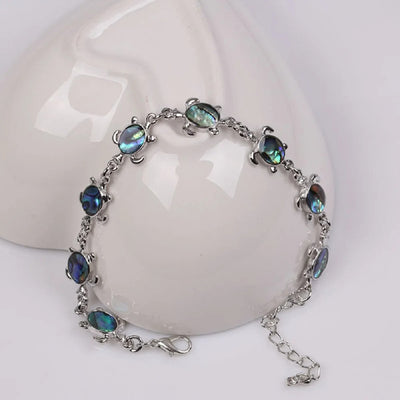 The Tropicana Honu Turtle Bracelet - A beautiful silver turtle bracelet adorned with lovely polished paua shell.