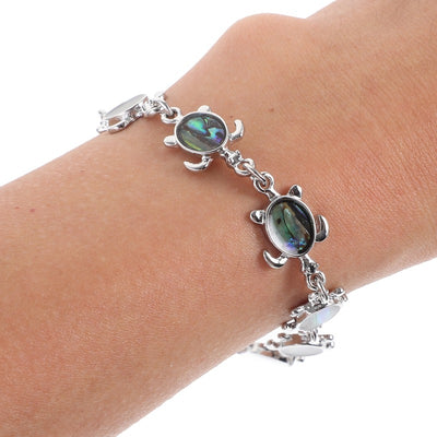 The Tropicana Honu Turtle Bracelet - A beautiful silver turtle bracelet adorned with lovely polished paua shell.