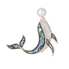 The Tropicana Kohola Whale Brooch - A beautiful gold-toned zinc alloy whale brooch adorned with polished paua shell and an artificial pearl.