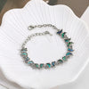 The Tropicana Lani Butterfly Bracelet - A beautiful silver butterfly bracelet adorned with lovely polished paua shell.