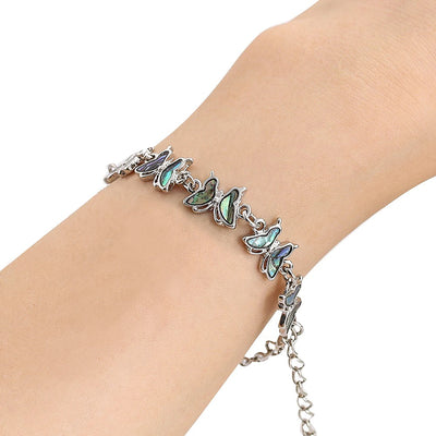 The Tropicana Lani Butterfly Bracelet - A beautiful silver butterfly bracelet adorned with lovely polished paua shell.