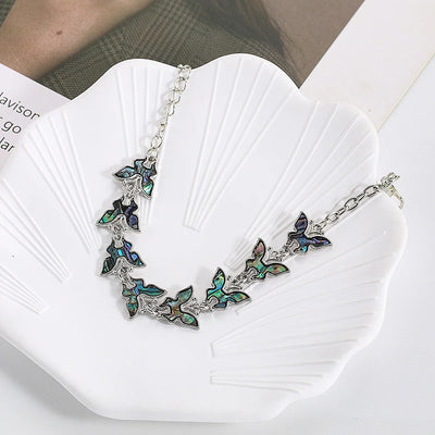 The Tropicana Lani Butterfly Bracelet - A beautiful silver butterfly bracelet adorned with lovely polished paua shell.