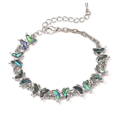 The Tropicana Lani Butterfly Bracelet - A beautiful silver butterfly bracelet adorned with lovely polished paua shell.