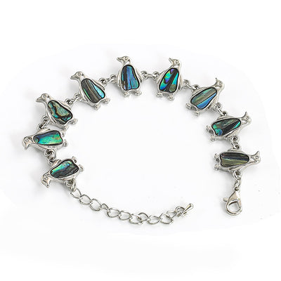 The Tropicana Manu Penguin Bracelet - A beautiful silver penguin bracelet adorned with lovely polished paua shell.