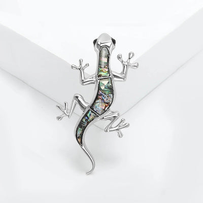Tropicana Mo'o Gecko Brooch - A stylised silver-toned zinc alloy gecko brooch adorned with polished paua shell and artificial crystals.