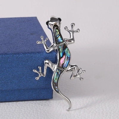 Tropicana Mo'o Gecko Brooch - A stylised silver-toned zinc alloy gecko brooch adorned with polished paua shell and artificial crystals.