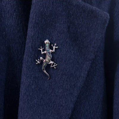 Tropicana Mo'o Gecko Brooch - A stylised silver-toned zinc alloy gecko brooch adorned with polished paua shell and artificial crystals.
