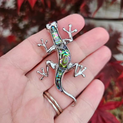 Tropicana Mo'o Gecko Brooch - A stylised silver-toned zinc alloy gecko brooch adorned with polished paua shell and artificial crystals.